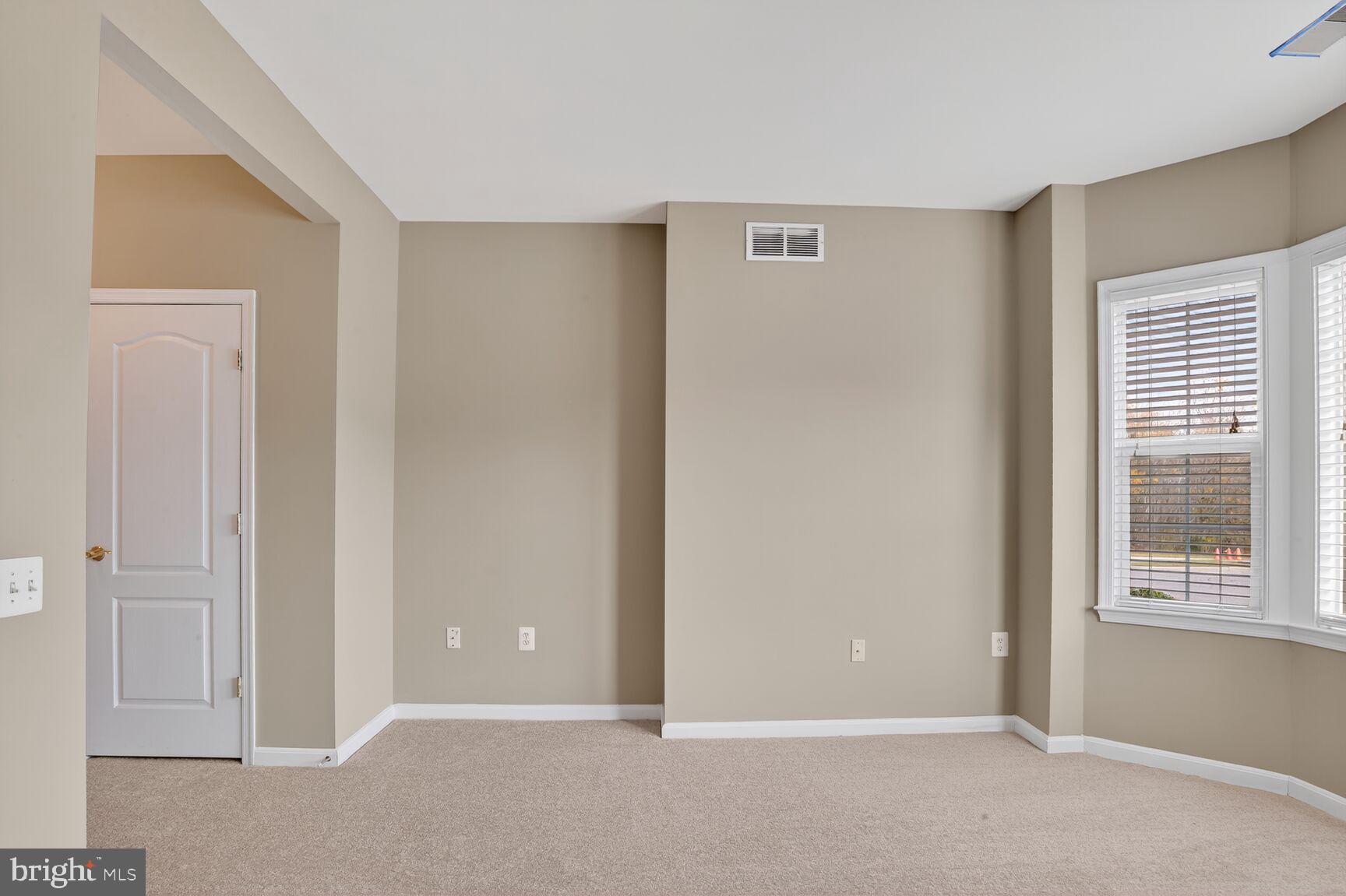 402 Aggies Circle, Unit 402D Bel Air, MD 21014 - Photo 10 of 29 a view of an empty room with window