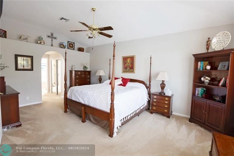 12253 Rockledge Circle Boca Raton, FL 33428 - Photo 12 of 22 a bed room with a bed and a tv