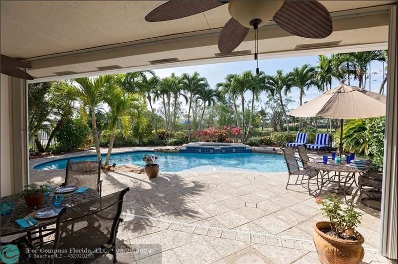 12253 Rockledge Circle Boca Raton, FL 33428 - Photo 20 of 22 a patio with patio table and chairs