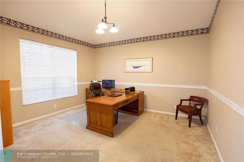 12253 Rockledge Circle Boca Raton, FL 33428 - Photo 3 of 22 a work room with furniture and a window