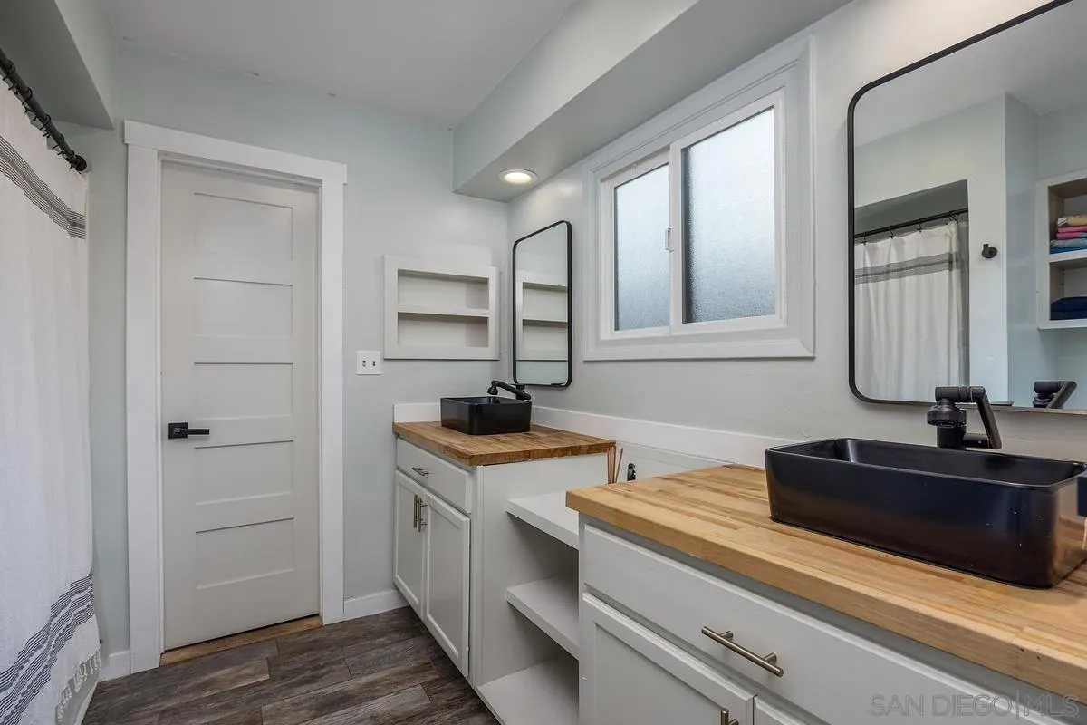 1211 East Mission Road Fallbrook, CA 92028 - Photo 24 of 31 a kitchen with a sink and cabinets