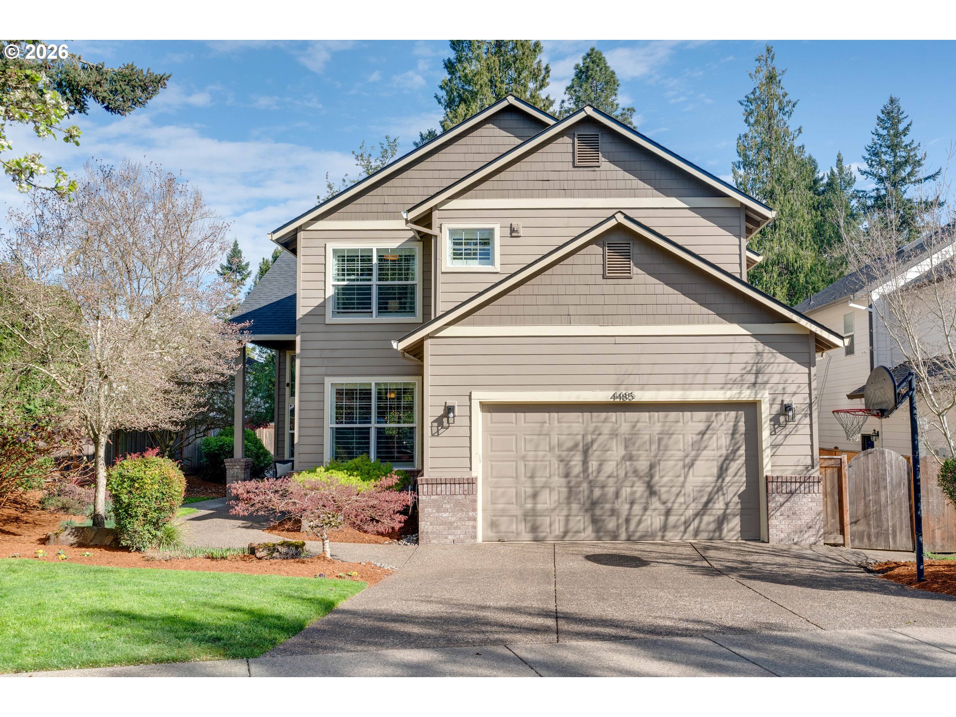 4485 Southwest Joshua Street Tualatin, OR 97062 - Photo 1 of 43 a front view of a house with garden