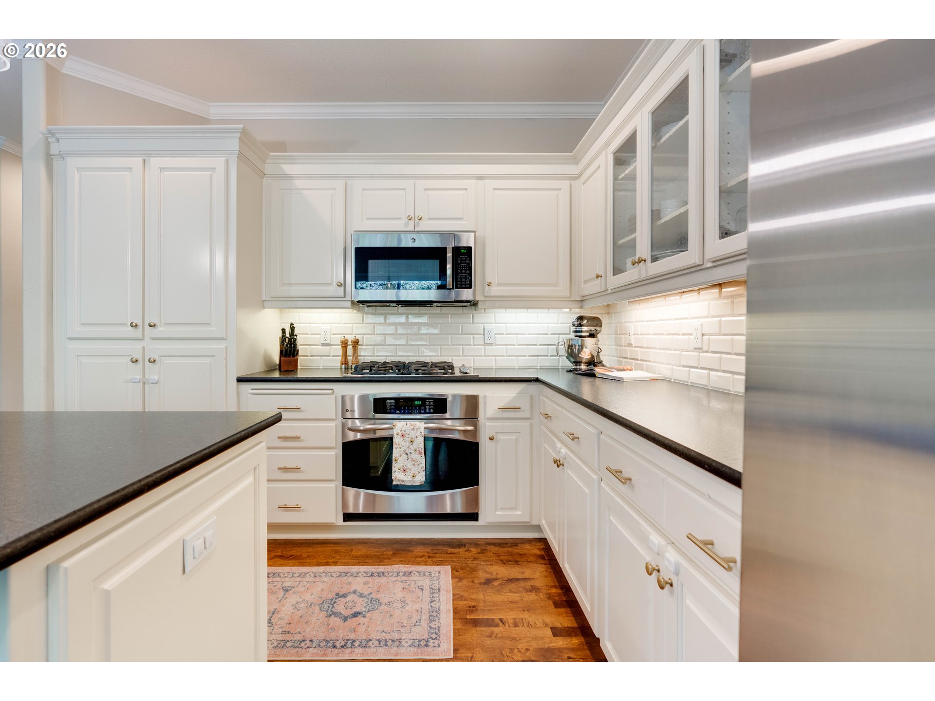 4485 Southwest Joshua Street Tualatin, OR 97062 - Photo 12 of 43 a kitchen with stainless steel appliances granite countertop a sink and a stove