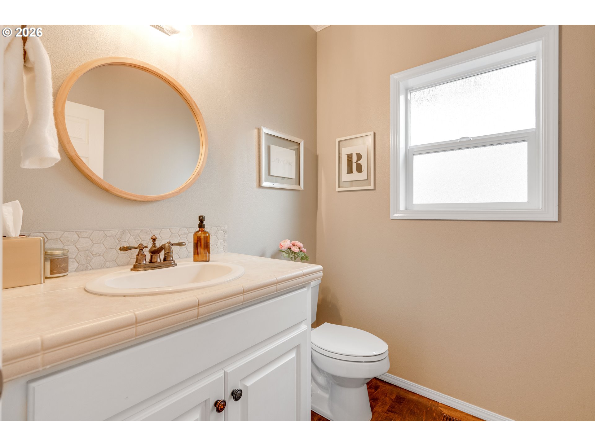 4485 Southwest Joshua Street Tualatin, OR 97062 - Photo 20 of 43 a bathroom with a sink a toilet and a mirror