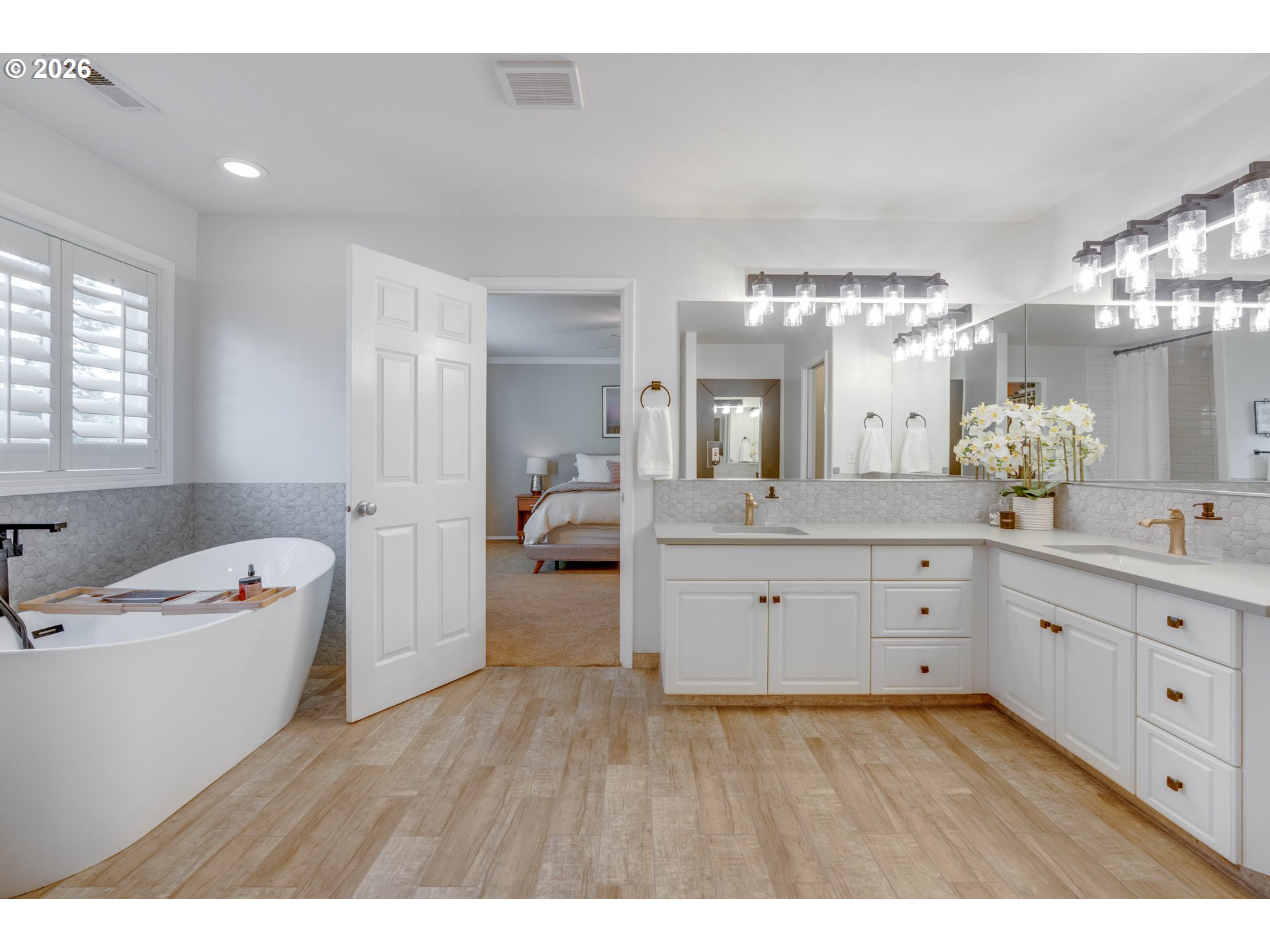 4485 Southwest Joshua Street Tualatin, OR 97062 - Photo 25 of 43 a spacious bathroom with a tub sink and a mirror