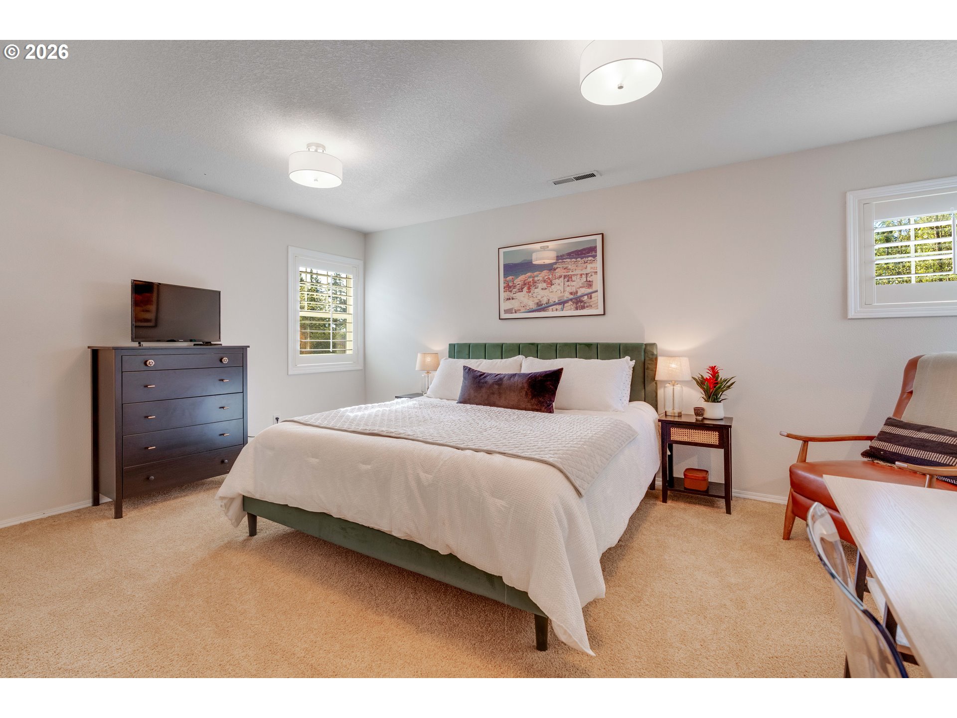 4485 Southwest Joshua Street Tualatin, OR 97062 - Photo 33 of 43 a bedroom with a bed and a flat screen tv