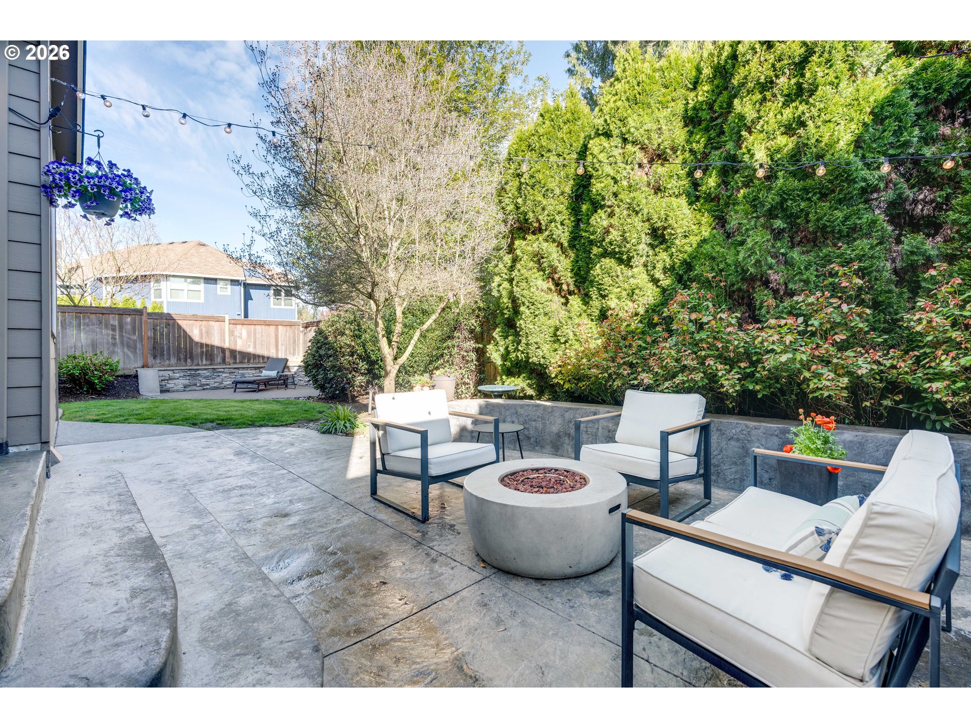 4485 Southwest Joshua Street Tualatin, OR 97062 - Photo 36 of 43 a view of a patio with table and chairs and potted plants