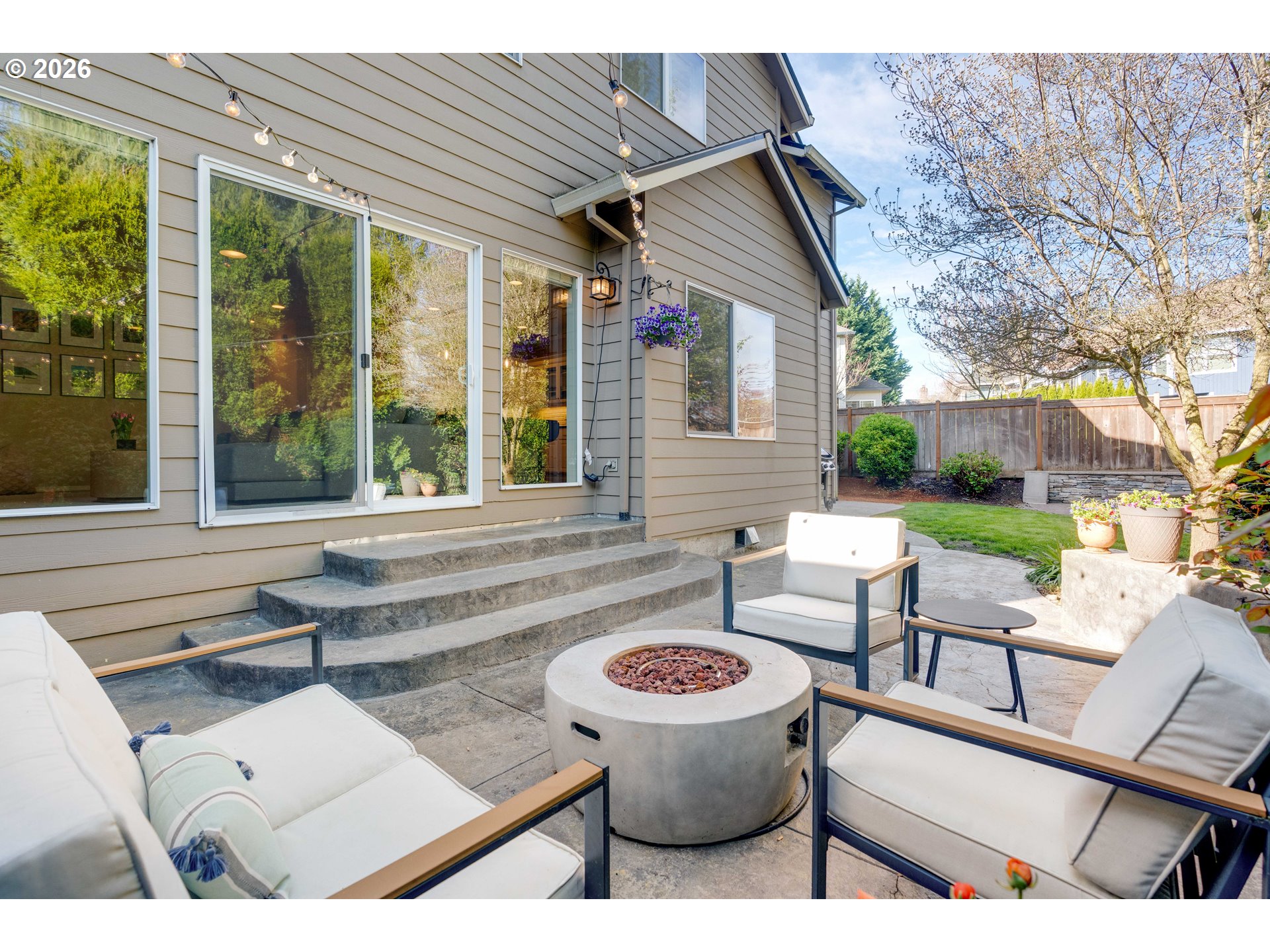 4485 Southwest Joshua Street Tualatin, OR 97062 - Photo 37 of 43 a view of a patio with couches table and chairs with wooden floor and fence