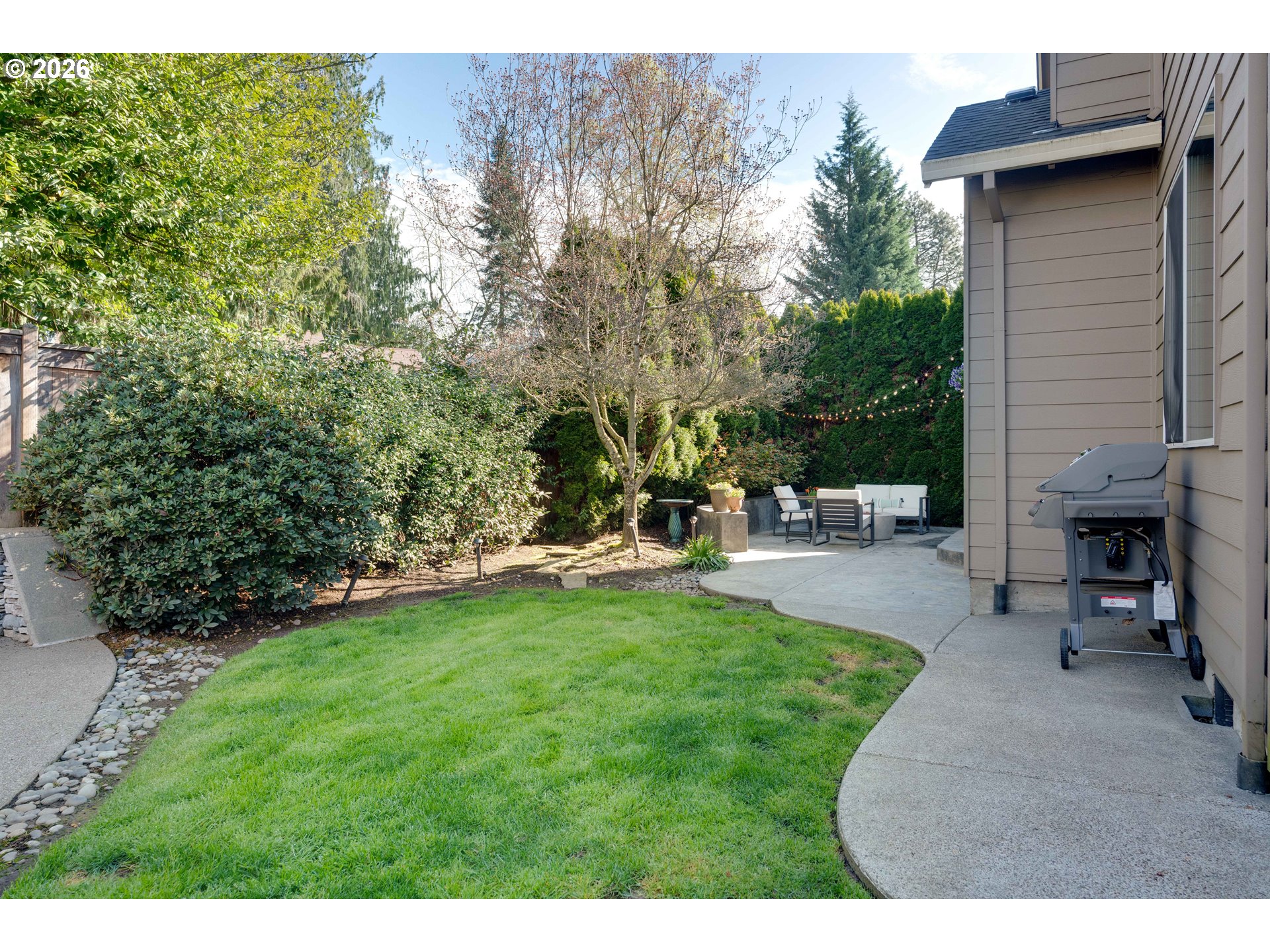 4485 Southwest Joshua Street Tualatin, OR 97062 - Photo 38 of 43 a view of a backyard with sitting area