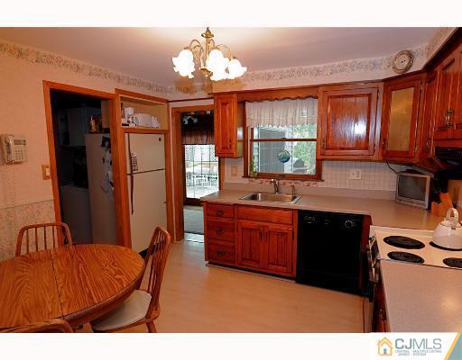 192 South Hill Road Colonia, NJ 07067 - Photo 3 of 7 a kitchen with stainless steel appliances kitchen island granite countertop a refrigerator a stove top oven a sink and dishwasher
