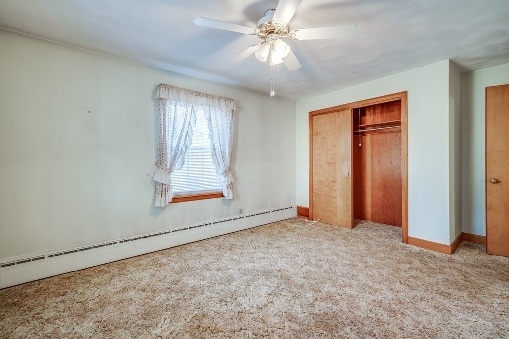 137 Lawrence Road Chicopee, MA 01013 - Photo 27 of 38 an empty room with a window and a ceiling fan