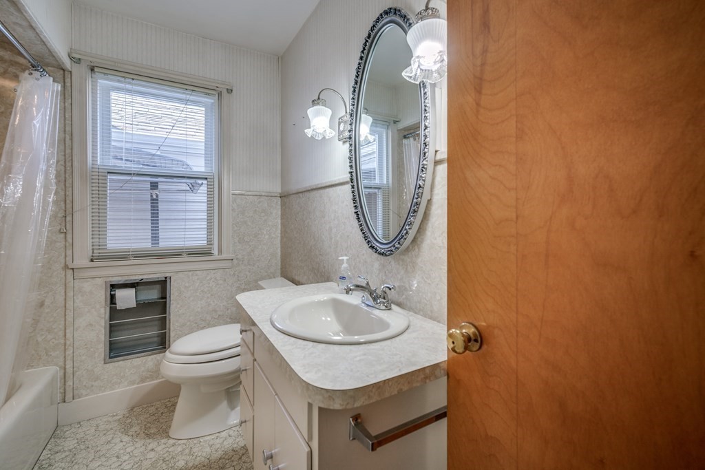 137 Lawrence Road Chicopee, MA 01013 - Photo 28 of 38 a bathroom with a sink a toilet and a mirror