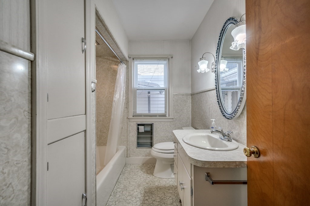 137 Lawrence Road Chicopee, MA 01013 - Photo 29 of 38 a bathroom with a sink toilet and mirror