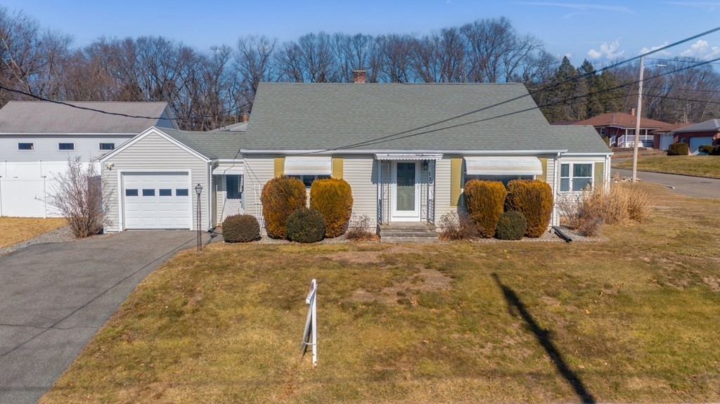 137 Lawrence Road Chicopee, MA 01013 - Photo 6 of 38 a front view of a house with garden
