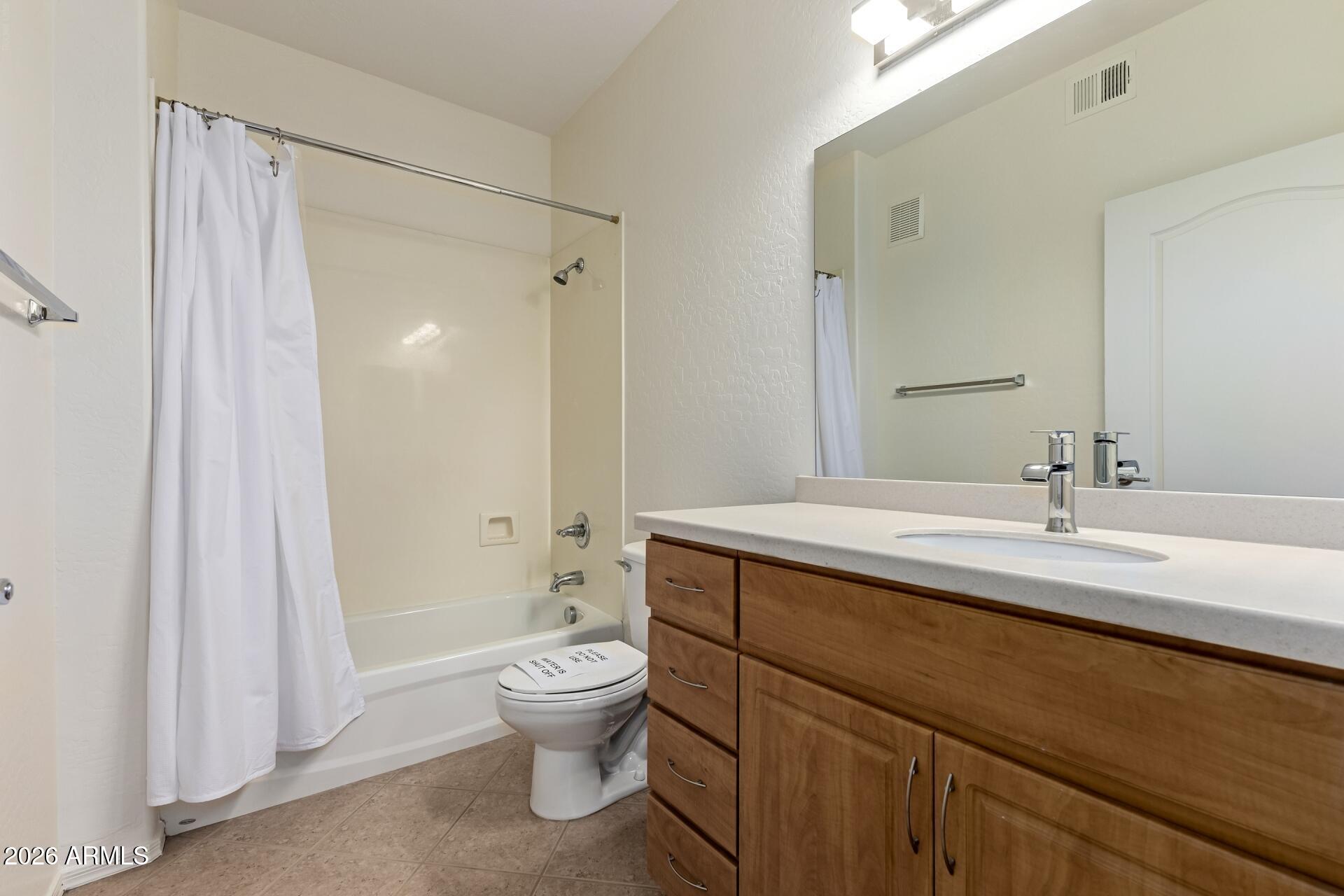705 West Queen Creek Road, Unit 1167 Chandler, AZ 85248 - Photo 23 of 31 a bathroom with a sink a toilet and shower