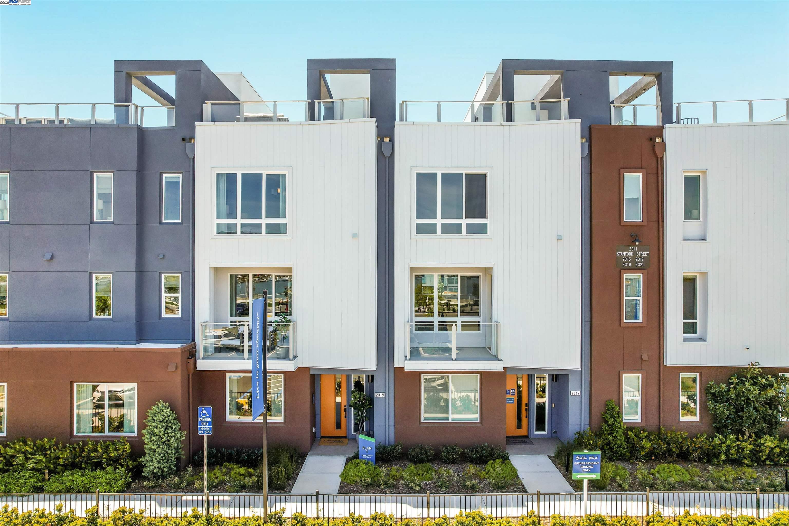 2256 Stanford Street Alameda, CA 94501 - Photo 2 of 60 a front view of a residential apartment building with a yard