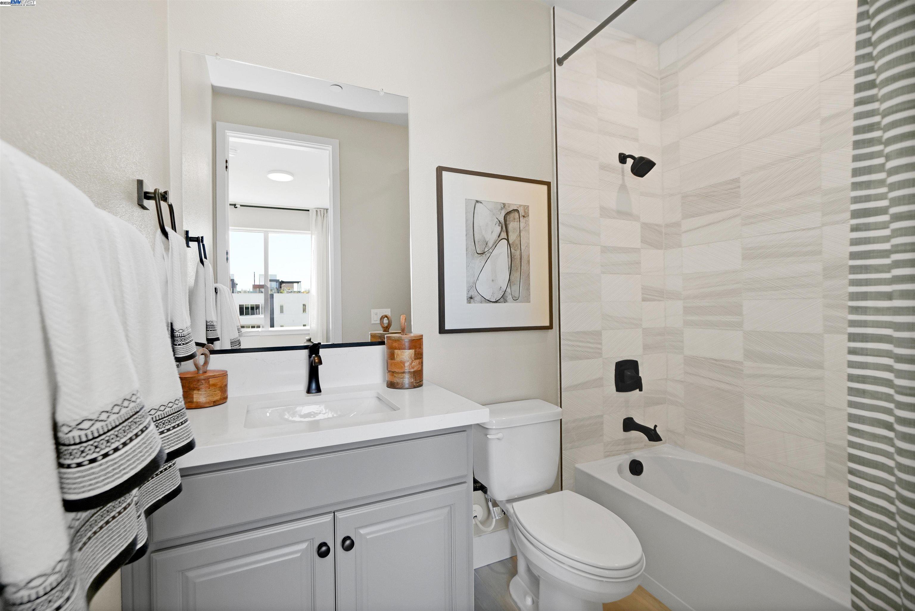 2256 Stanford Street Alameda, CA 94501 - Photo 30 of 60 a bathroom with a sink toilet and shower