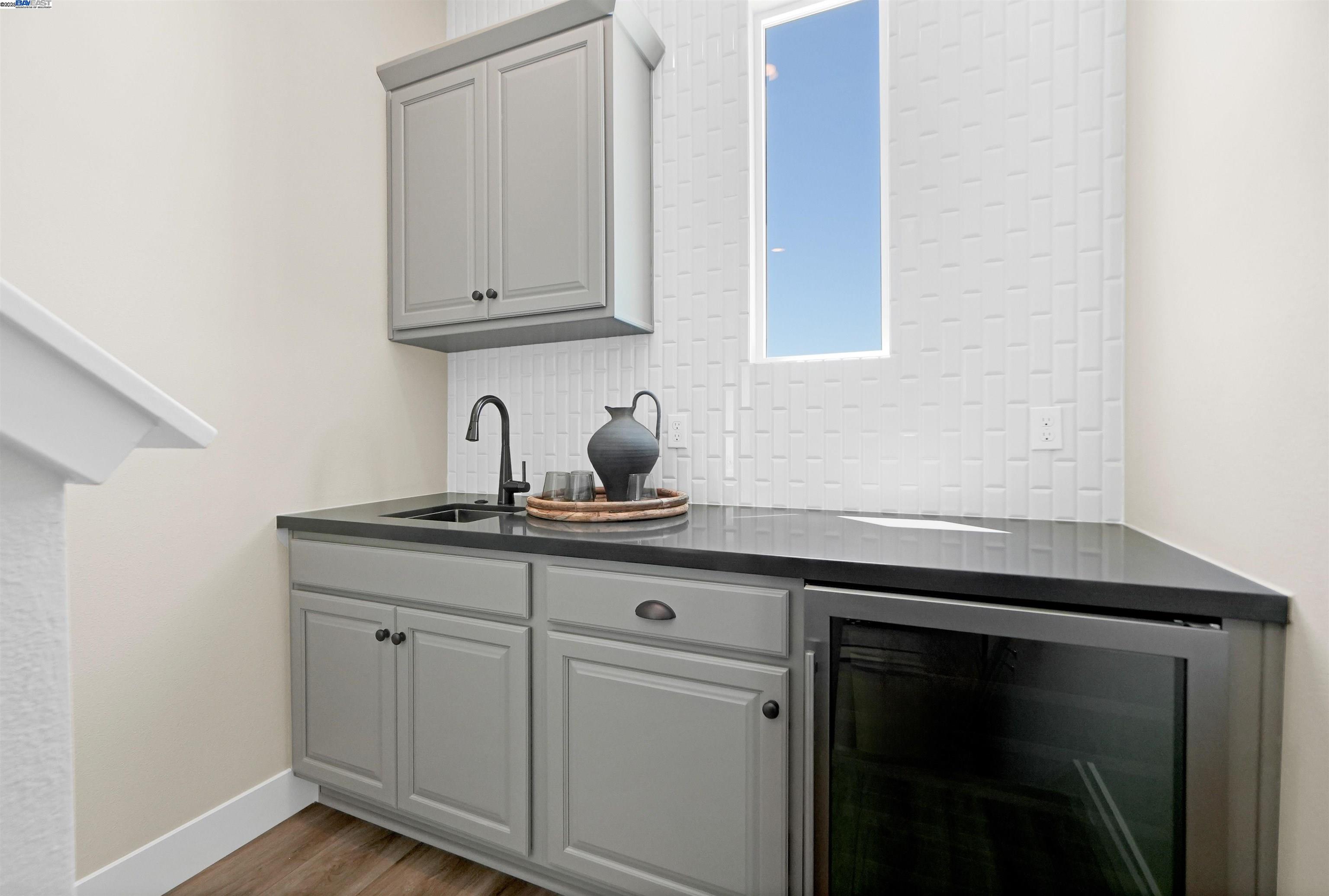 2256 Stanford Street Alameda, CA 94501 - Photo 40 of 60 a kitchen with white cabinets and sink