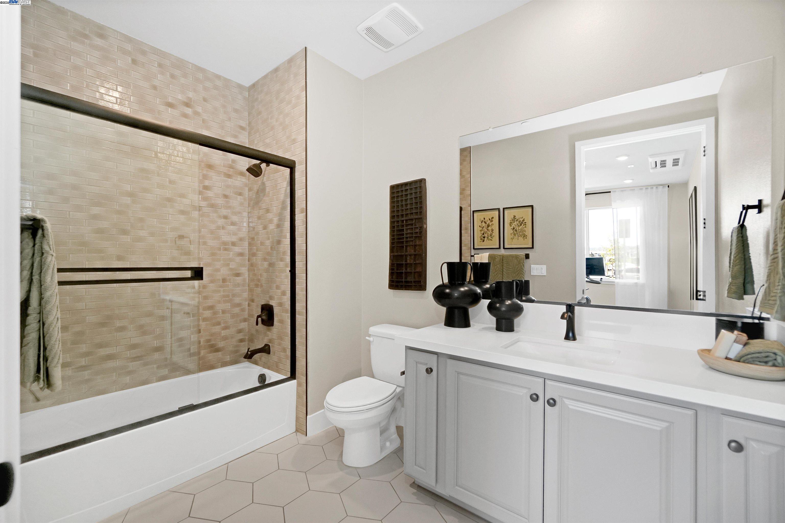 2256 Stanford Street Alameda, CA 94501 - Photo 9 of 60 a bathroom with a double vanity sink toilet and shower