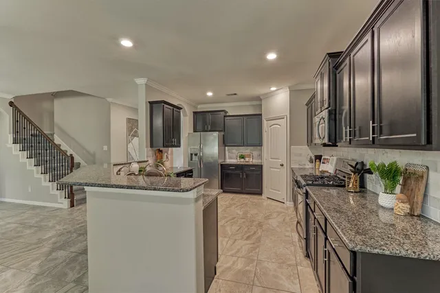 a dining room with furniture and window
