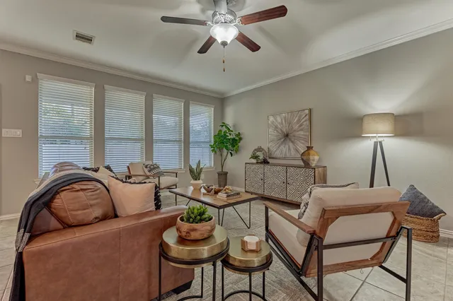 a living room with furniture and a large window