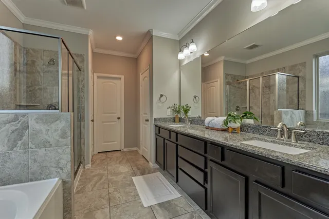 a white bath tub sitting next to a shower