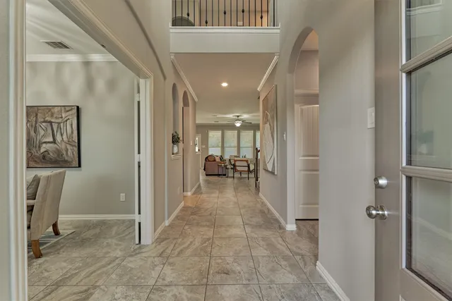 a living room with furniture and potted plant