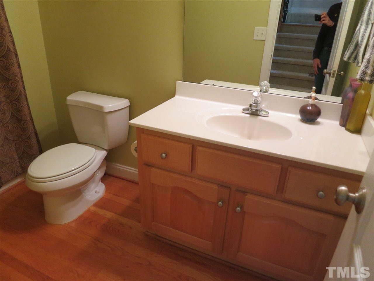 1328 Taylor Farm Road Raleigh, NC 27603 - Photo 14 of 24 a bathroom with a sink and a toilet