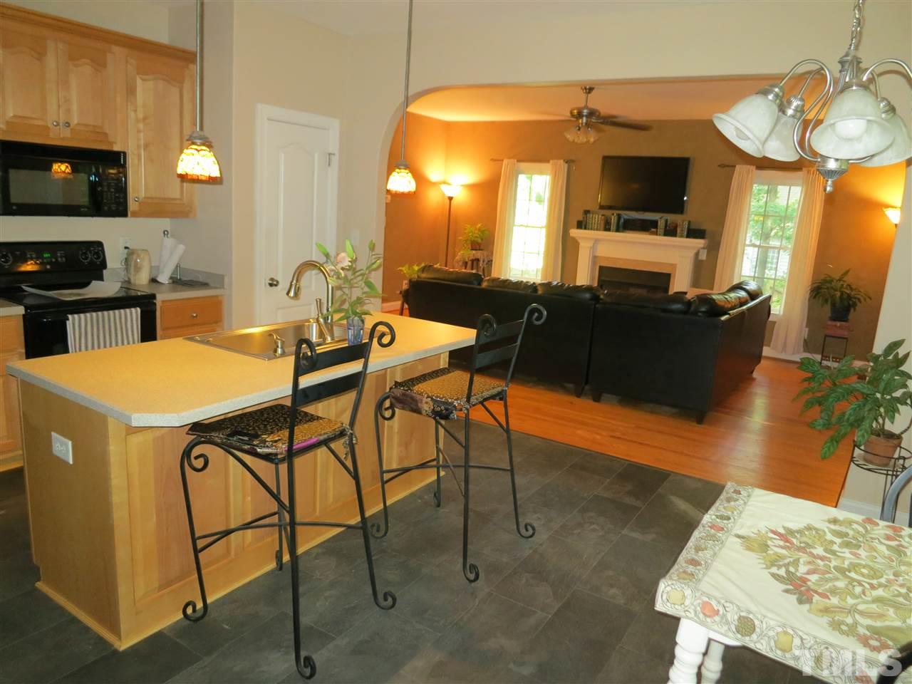 1328 Taylor Farm Road Raleigh, NC 27603 - Photo 5 of 24 a view of a dining room with furniture