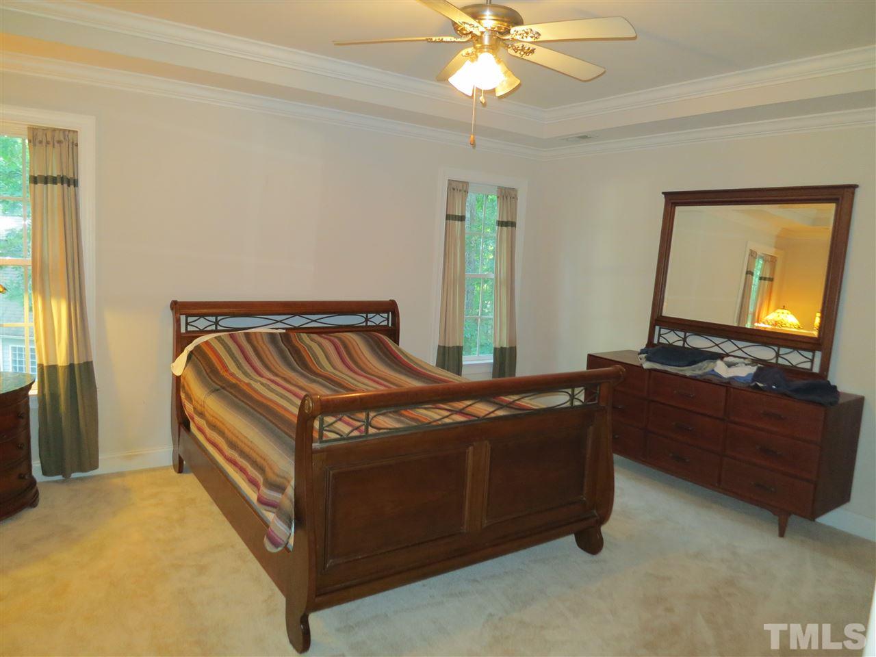 1328 Taylor Farm Road Raleigh, NC 27603 - Photo 8 of 24 a bedroom with a bed and window