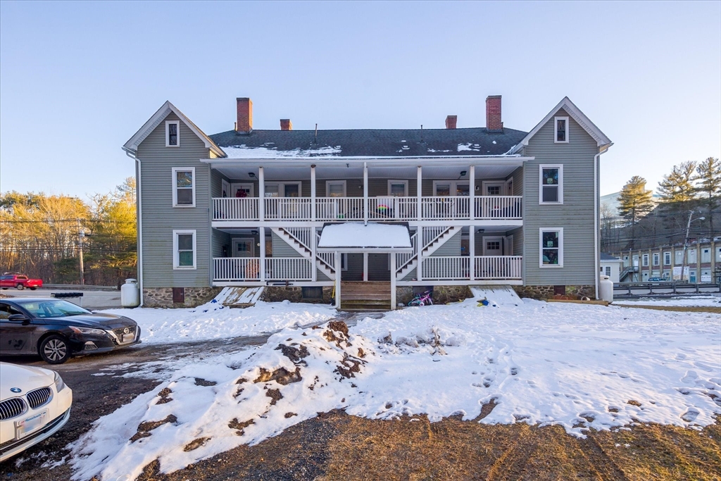40 Sturbridge Road Charlton, MA 01507 - Photo 1 of 21 a front view of a house with a yard covered in snow