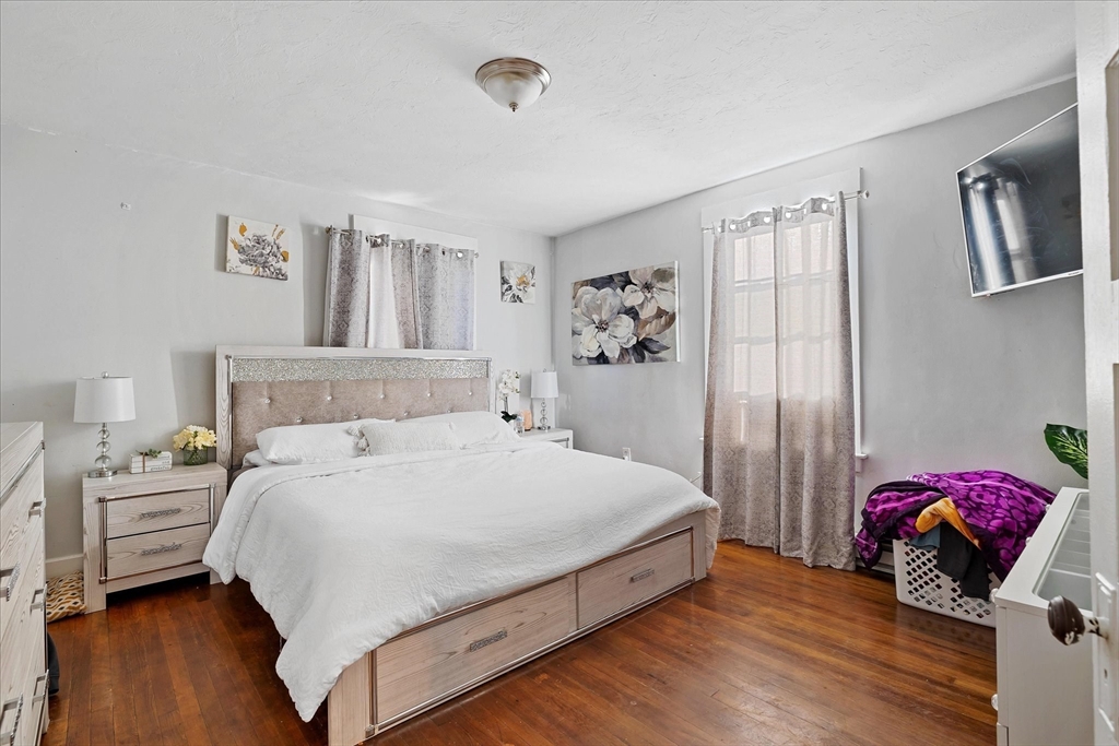 40 Sturbridge Road Charlton, MA 01507 - Photo 11 of 21 a bedroom with a bed and wooden floor