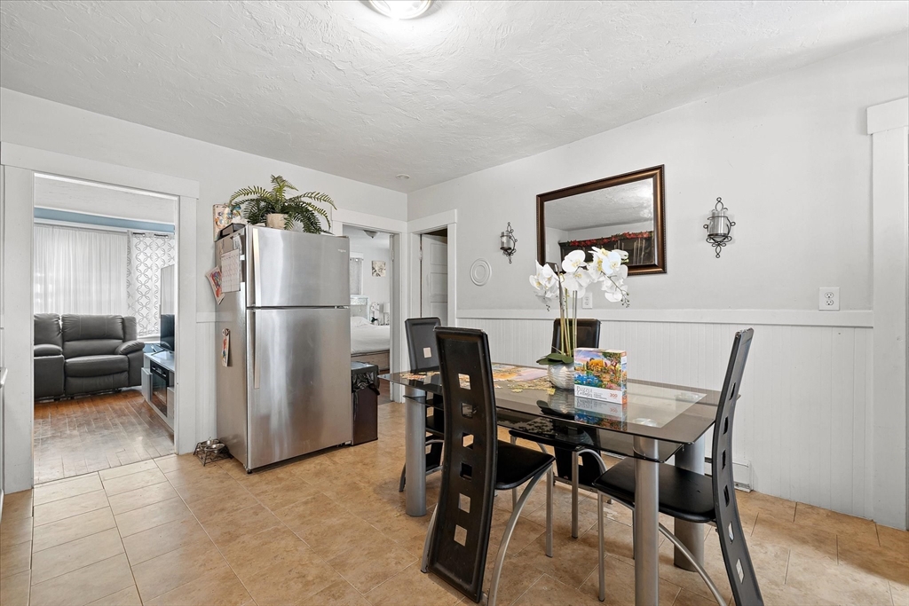 40 Sturbridge Road Charlton, MA 01507 - Photo 8 of 21 a view of a dining room with furniture and a refrigerator