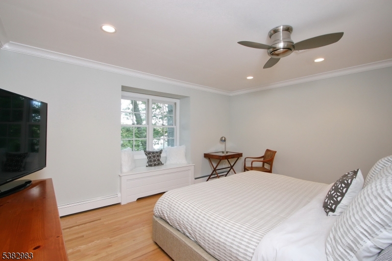 107 Lake End Road Newfoundland, NJ 07435 - Photo 17 of 23 a bedroom with a bed and a large window