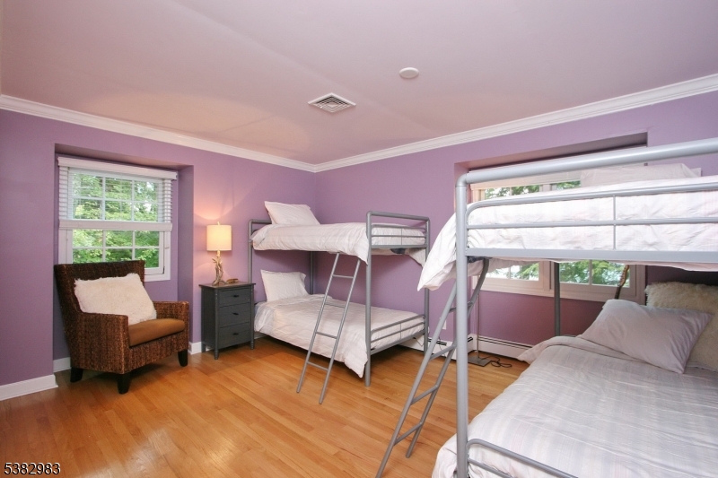 107 Lake End Road Newfoundland, NJ 07435 - Photo 19 of 23 a bedroom with furniture and a large window