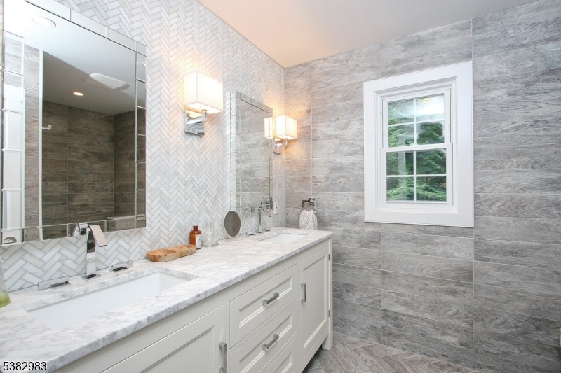 107 Lake End Road Newfoundland, NJ 07435 - Photo 20 of 23 a bathroom with a granite countertop sink mirror and a bath tub
