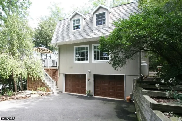 a front view of a house with yard