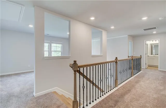 a view of a hallway with windows