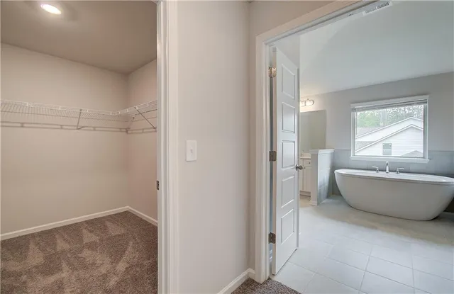 a bathroom with a tub and shower