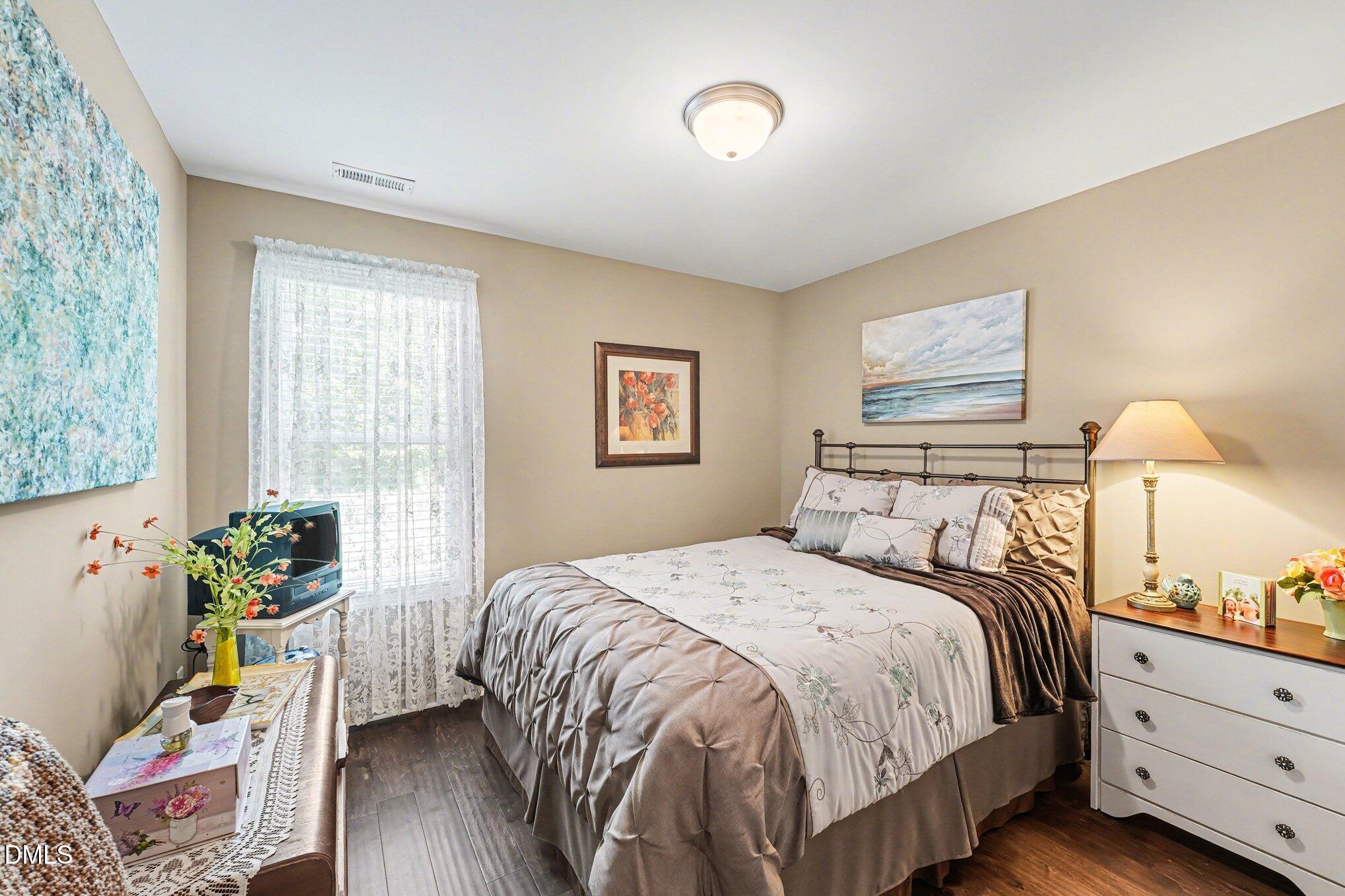 109 His Way Middlesex, NC 27557 - Photo 9 of 21 a bedroom with a bed and a window