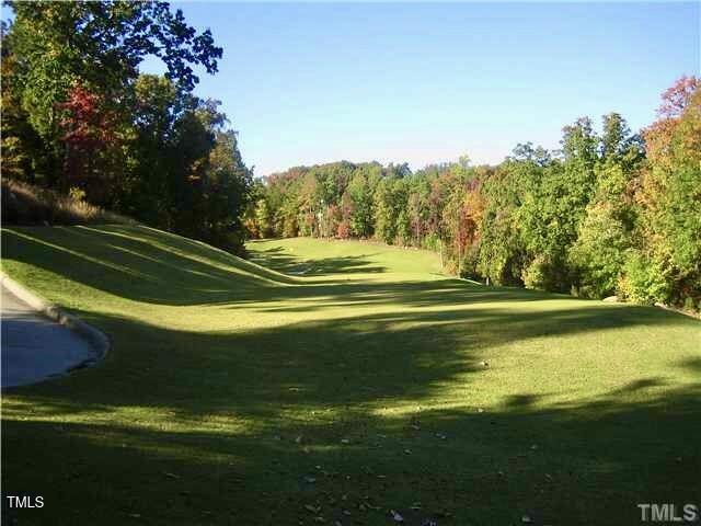 11515 McLean Chapel Hill, NC 27517 - Photo 7 of 8 a view of a golf course with a lake view