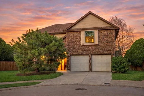 a front view of a house with garage