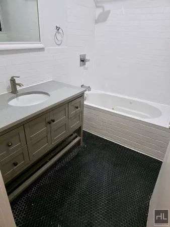 a bathroom with a sink and a bathtub
