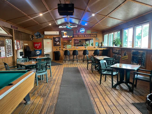 a view of a patio with table and chairs with wooden floor