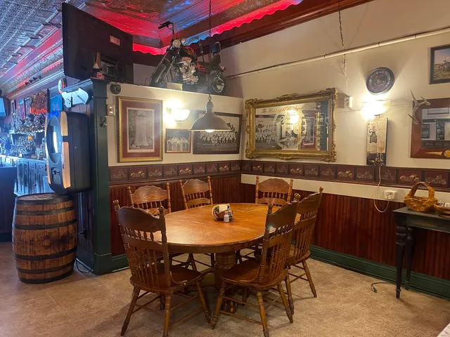 a dining area with a table and chairs
