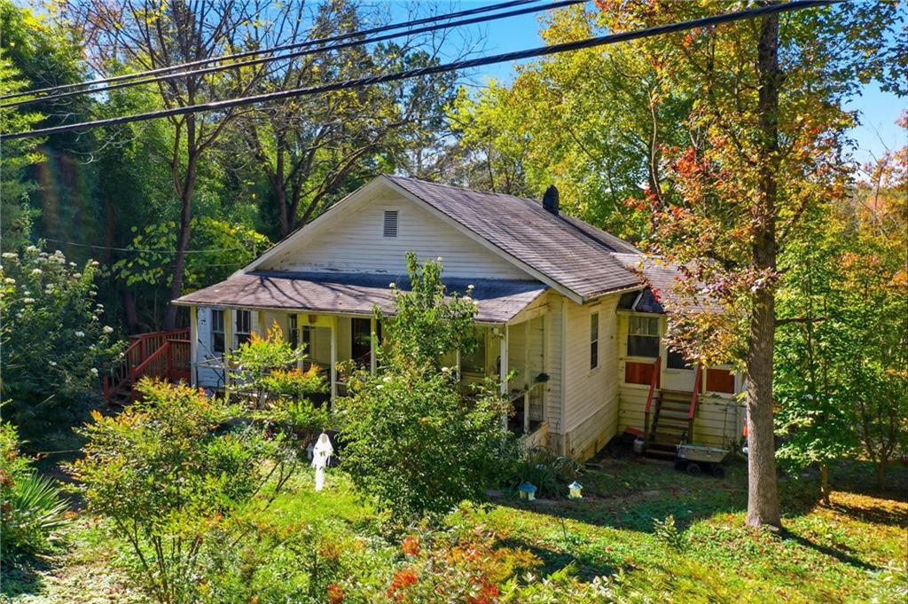 348 Old Tate Road Jasper, GA 30143 - Photo 4 of 35 a view of a house with a yard