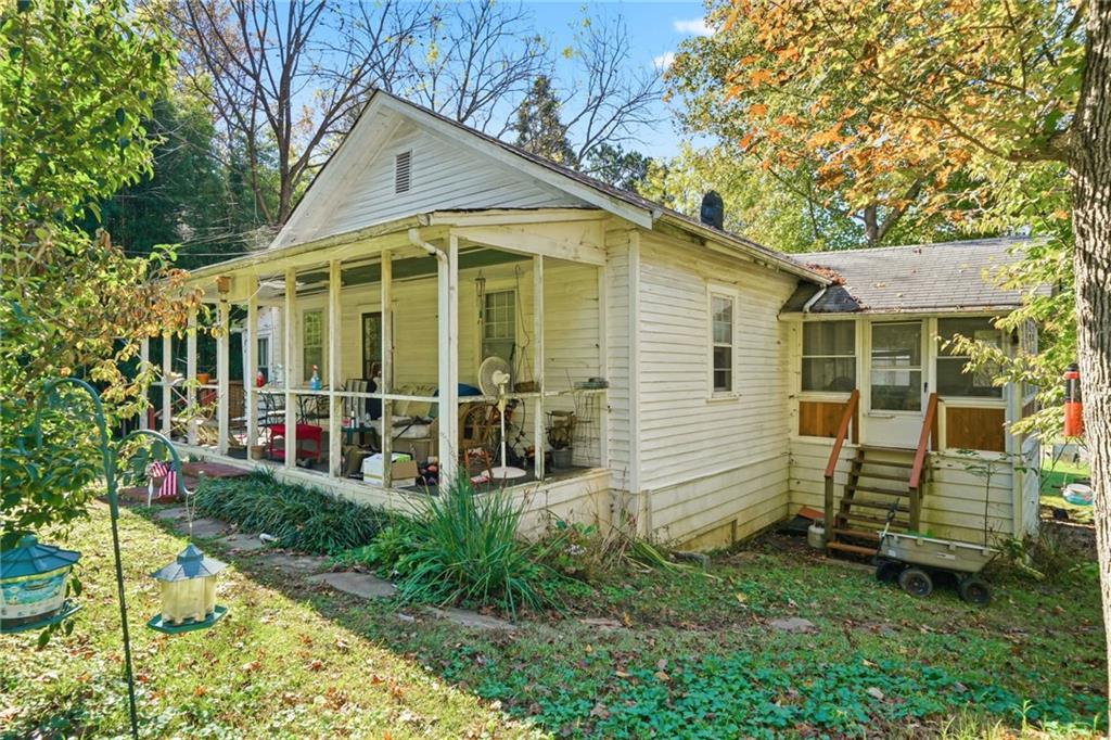 348 Old Tate Road Jasper, GA 30143 - Photo 5 of 35 a view of a house with a yard