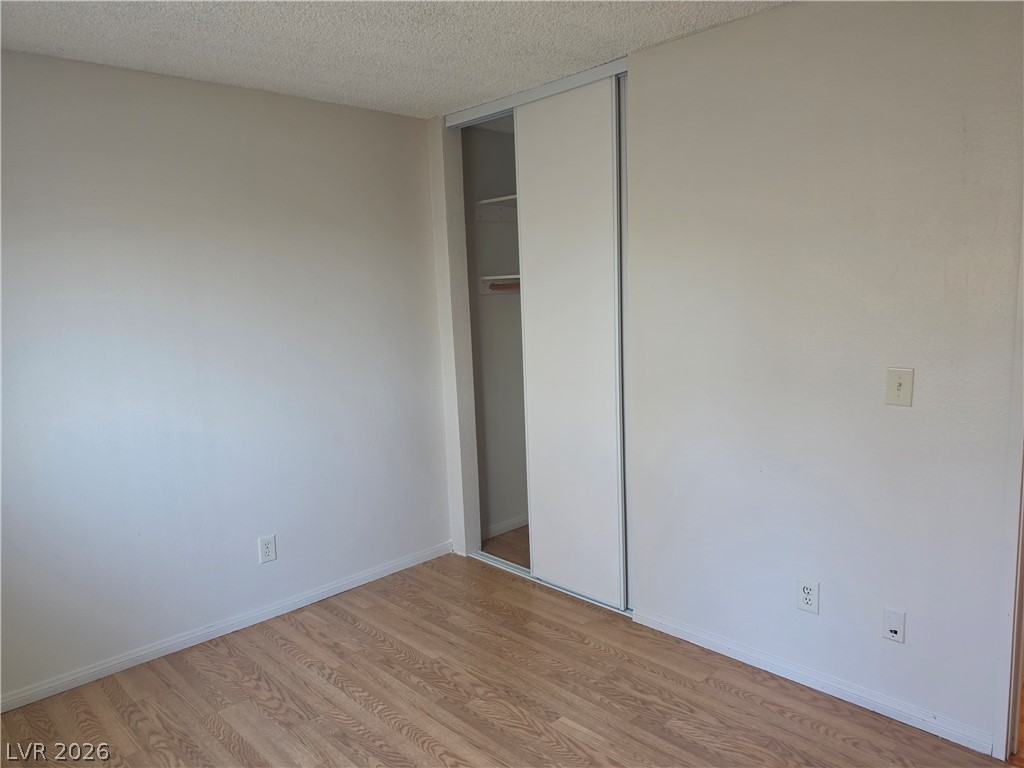 5289 Reeder Circle Las Vegas, NV 89119 - Photo 22 of 40 Gleaming wood-look floors pair with neutral walls and a built-in sliding closet.