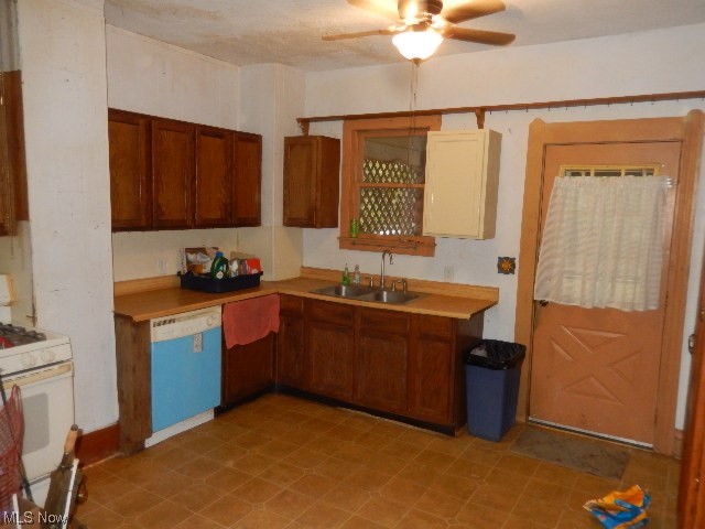 1302 Duncan Street Southwest Massillon, OH 44647 - Photo 17 of 22 Kitchen with sink, ceiling fan, white appliances, and light tile floors