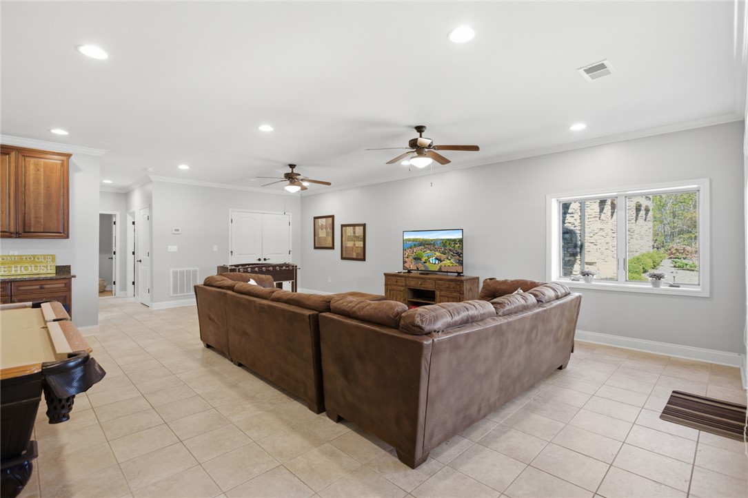 578 Sunset Point Drive West Union, SC 29696 - Photo 29 of 46 This spacious recreational room offers ample space for relaxation and entertainment.